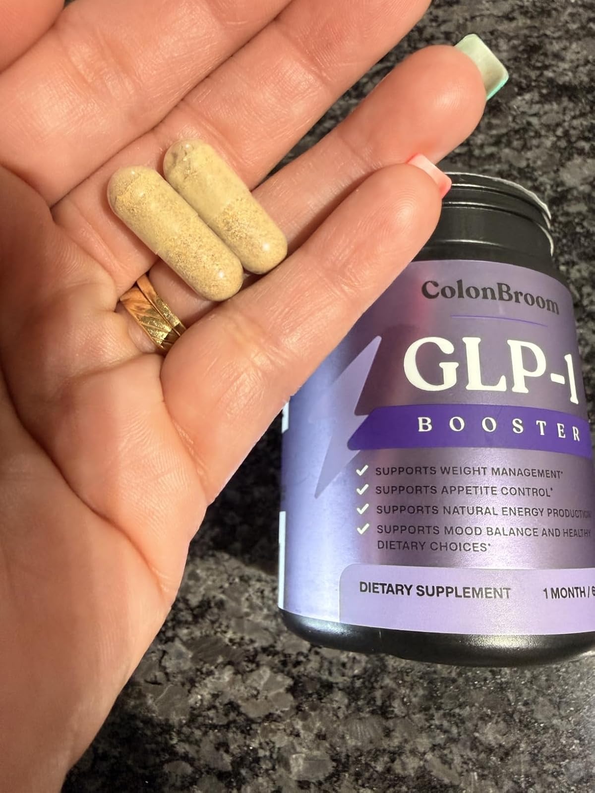 Adult reading the ColonBroom GLP-1 Booster label before a meal